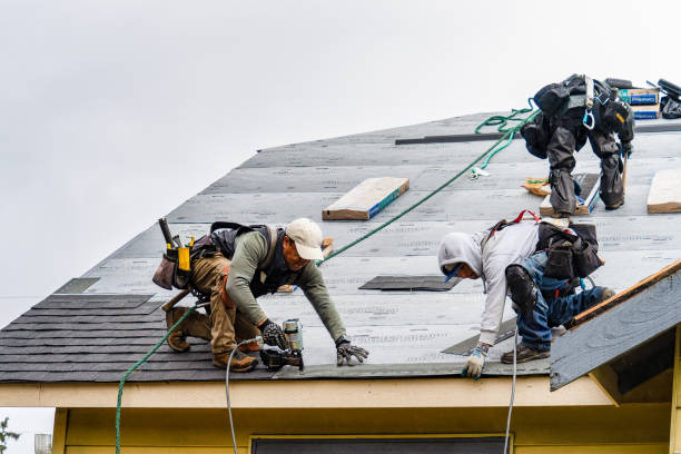Professional Storm Damage Roof Repair technician working in East Hampton, NY